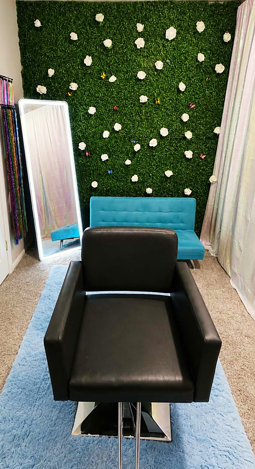 Inside the Sparklee by Jenny studio -
           the flower wall, the lit mirror and the styling chair